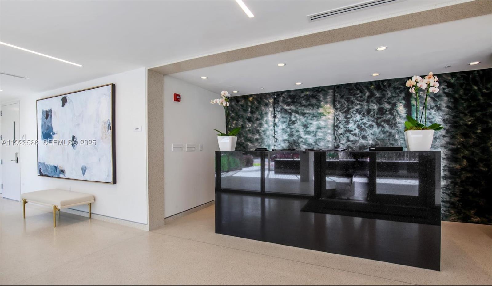 300 Collins Avenue, Unit PH2 Miami Beach, FL 33139 - Photo 18 of 21 a living room with furniture and a floor to ceiling window