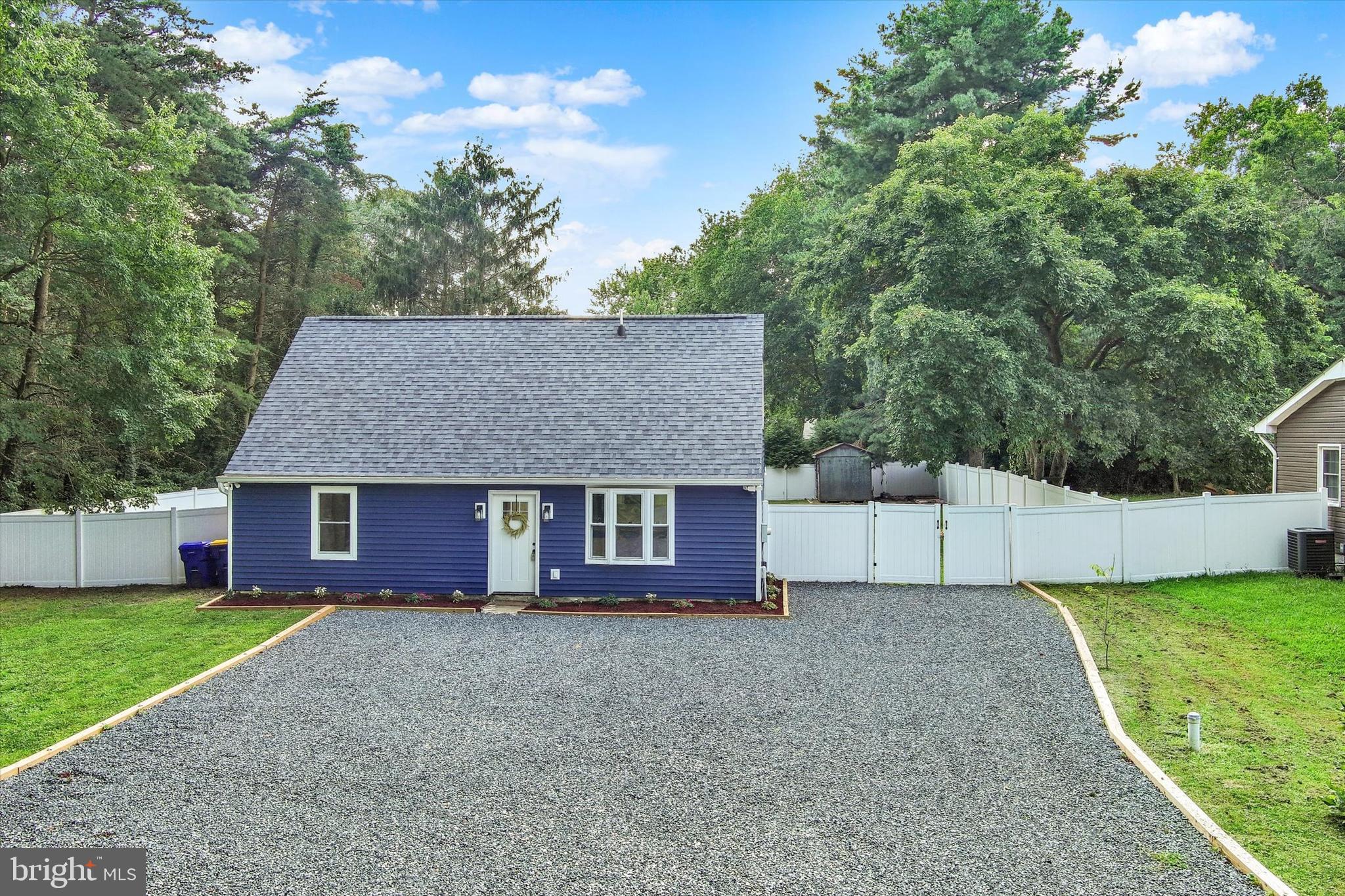 102 Maple Road Stevensville, MD 21666 - Photo 42 of 43 a view of a house with a yard and large tree