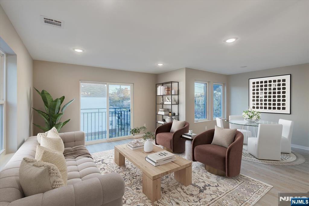 581 Bergen Street Newark, NJ 07108 - Photo 4 of 21 a living room with furniture and a large window