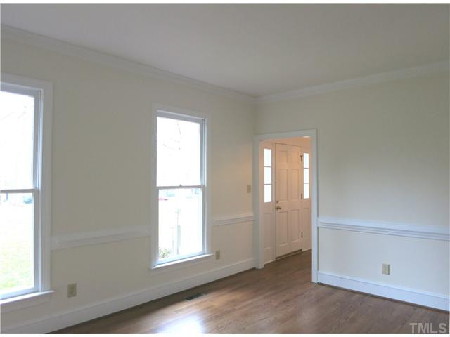 On the right of the Foyer is the formal Living Rm w/hardwd flr & crown/chair rail molding. Living Room
