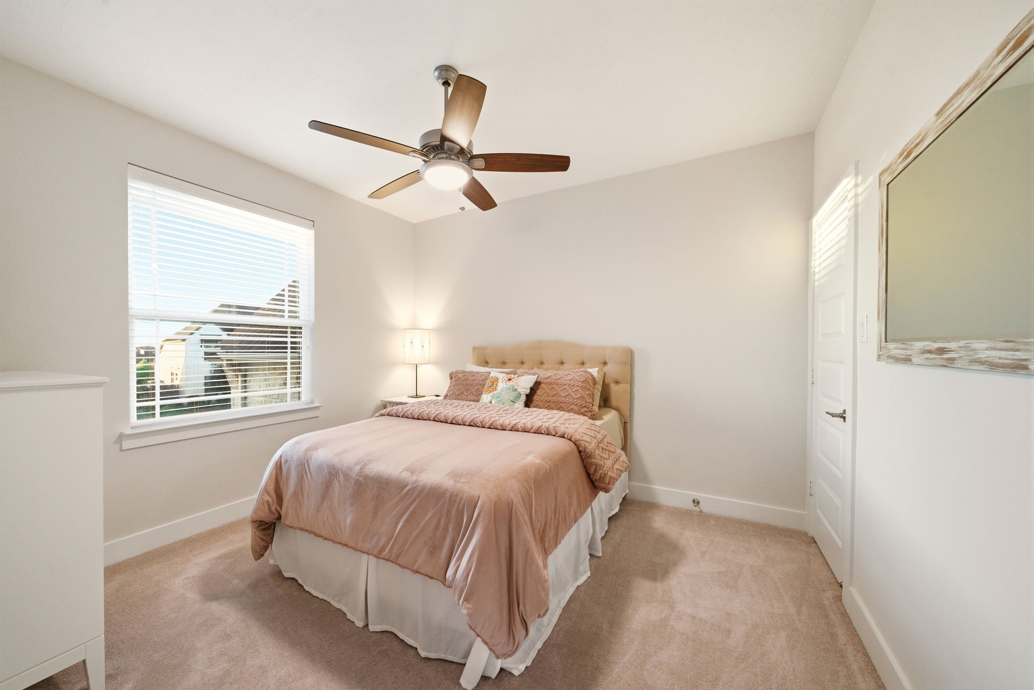 28811 Ember Crest Lane Fulshear, TX 77441 - Photo 29 of 47 a bedroom with a bed and a window