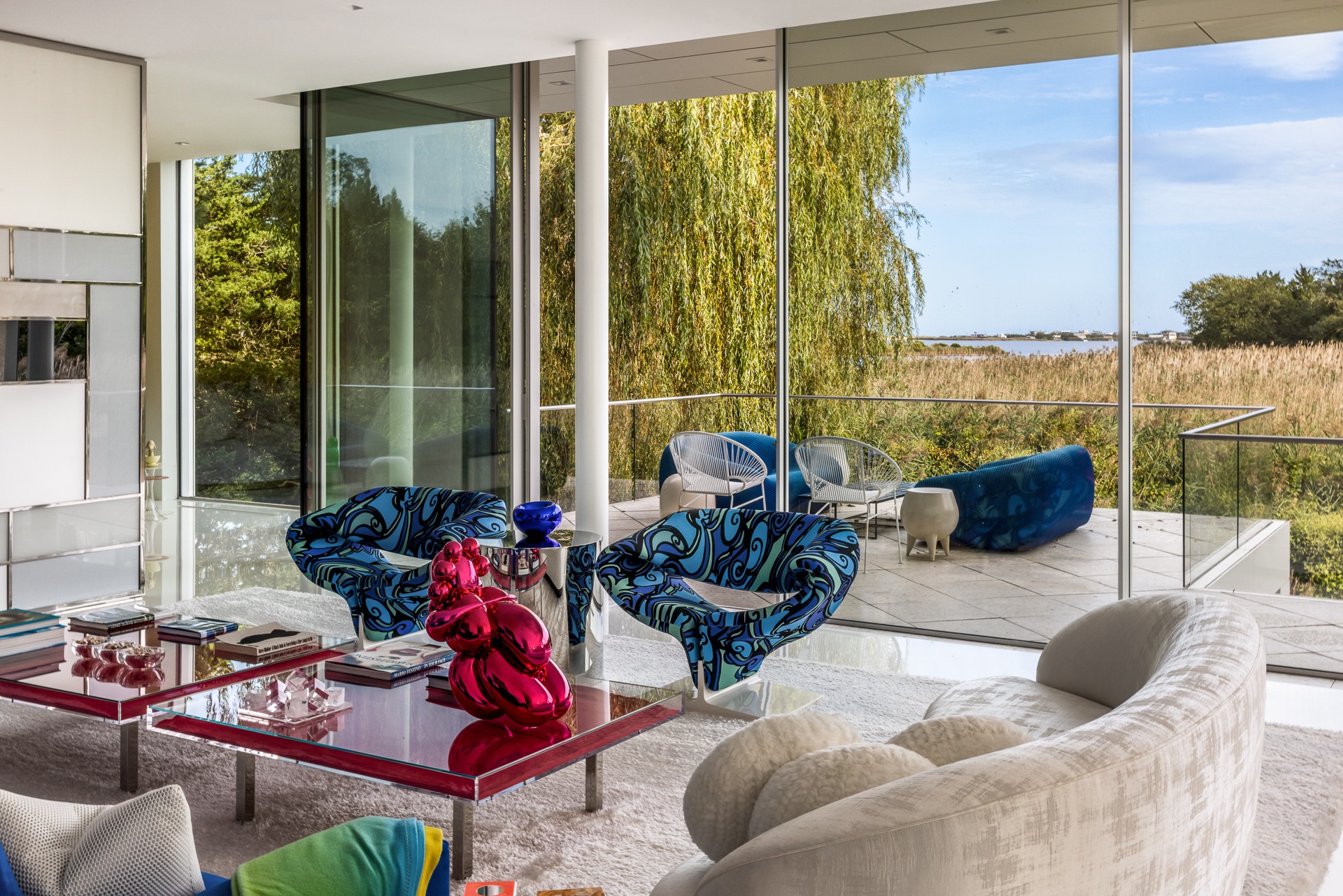 34 Cobb Isle Road Water Mill, NY 11976 - Photo 16 of 37 a living room with furniture and a floor to ceiling window