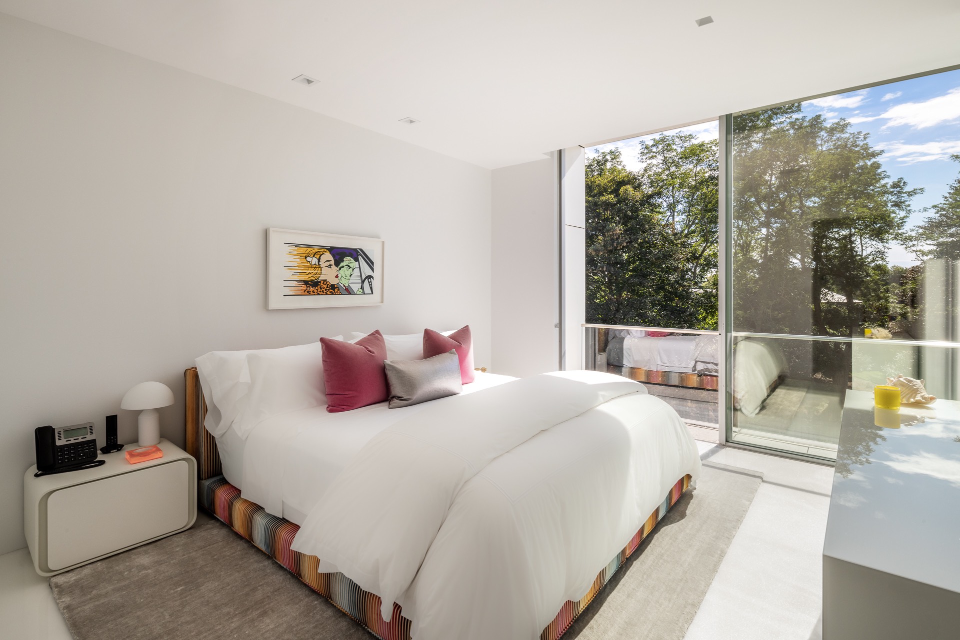 34 Cobb Isle Road Water Mill, NY 11976 - Photo 22 of 37 a bedroom with a bed and a large window