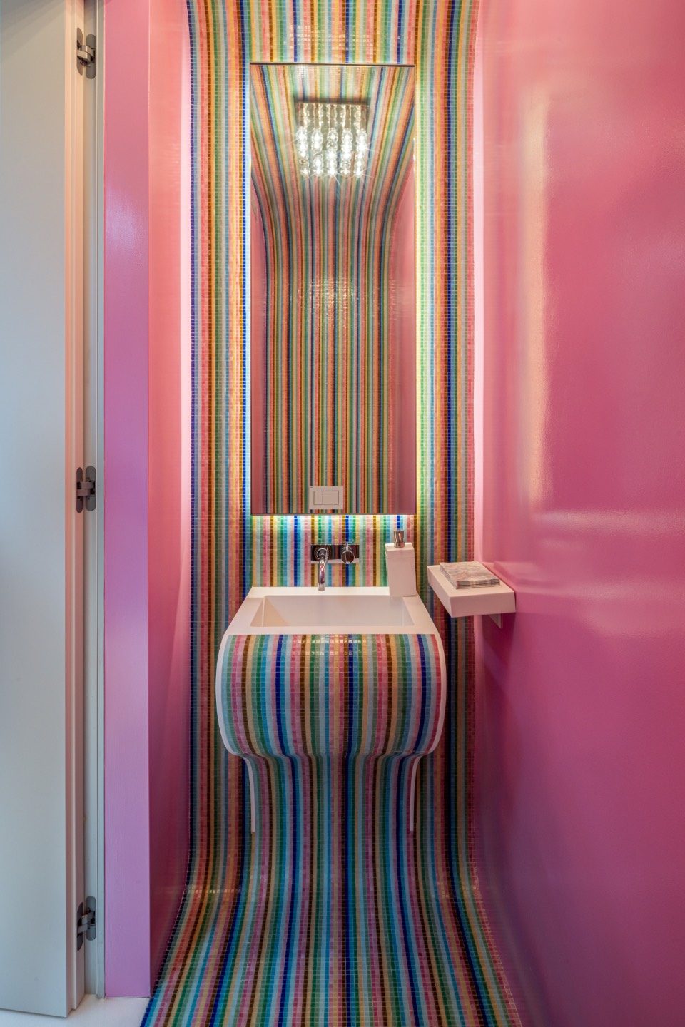 34 Cobb Isle Road Water Mill, NY 11976 - Photo 27 of 37 a bedroom with a bed and a chandelier