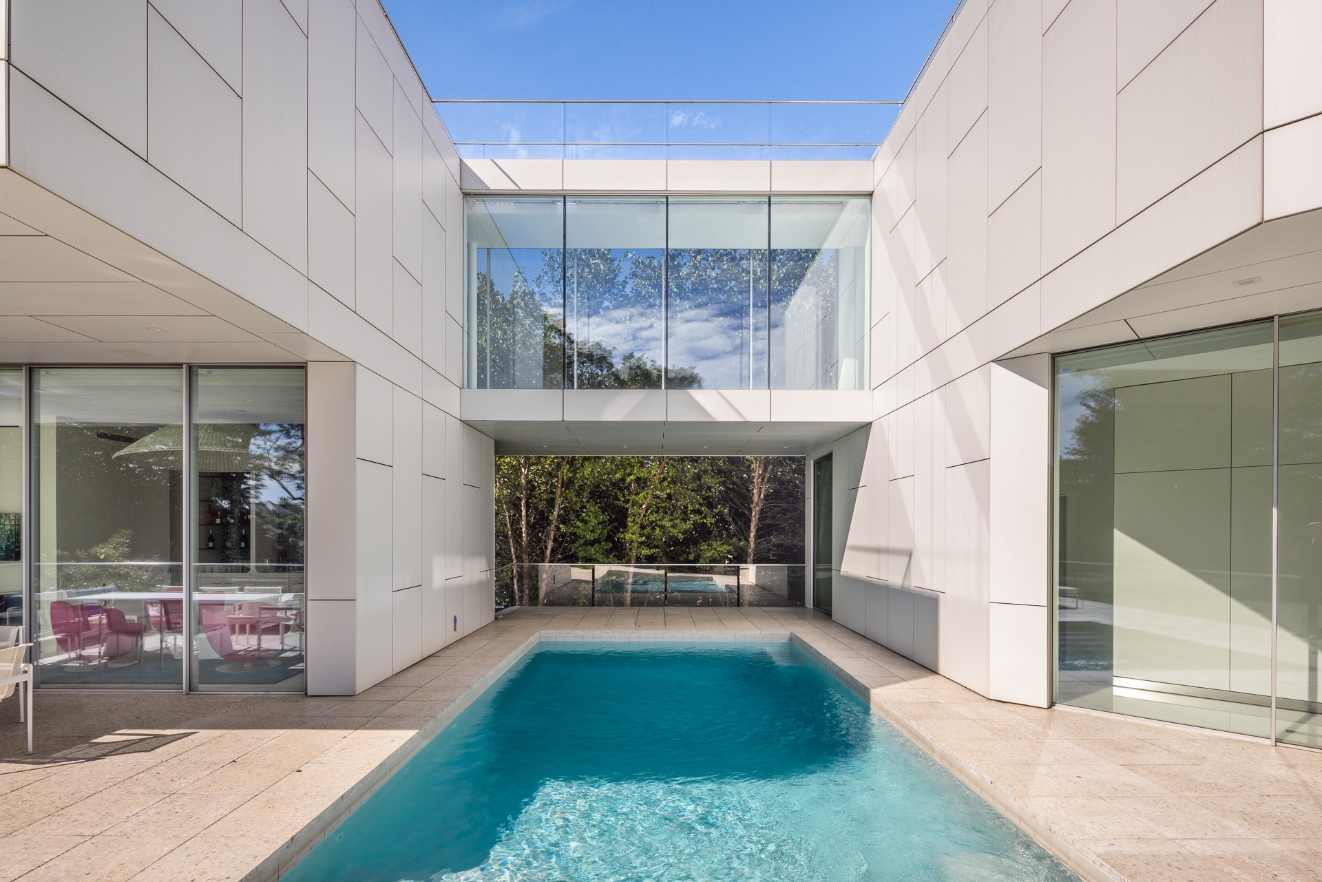 34 Cobb Isle Road Water Mill, NY 11976 - Photo 28 of 37 a front view of a building with a garden