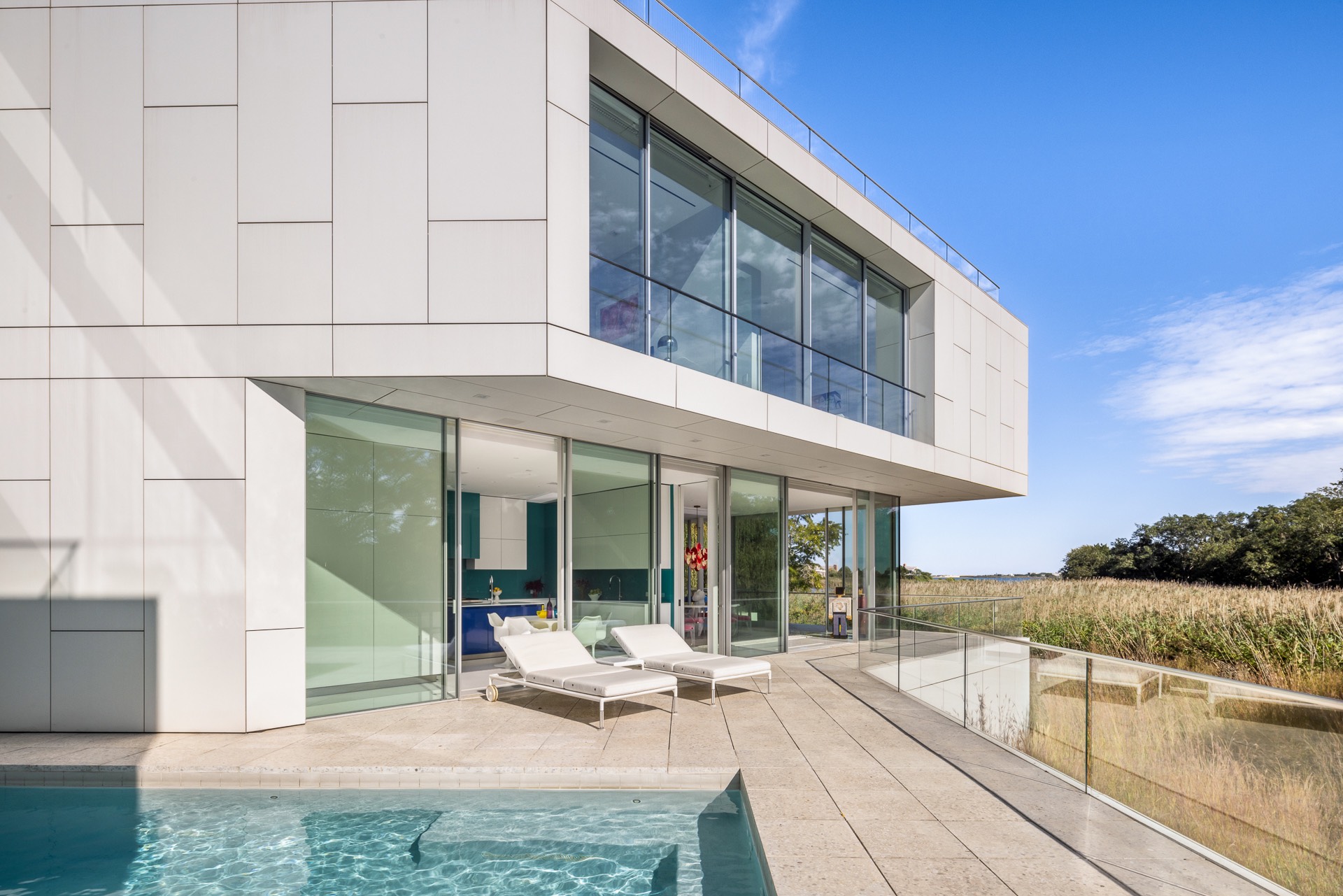 34 Cobb Isle Road Water Mill, NY 11976 - Photo 30 of 37 a view of a house with backyard porch and sitting area