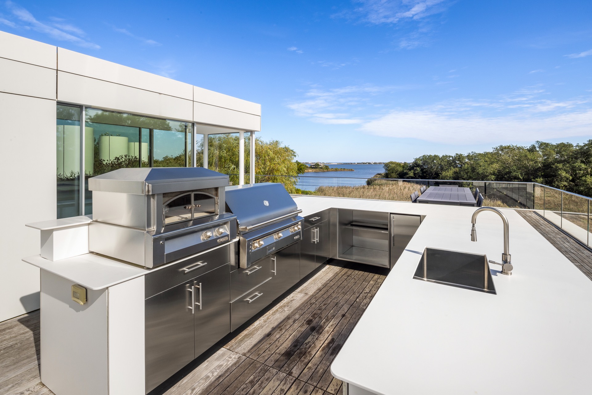 34 Cobb Isle Road Water Mill, NY 11976 - Photo 35 of 37 a view of a balcony with chairs
