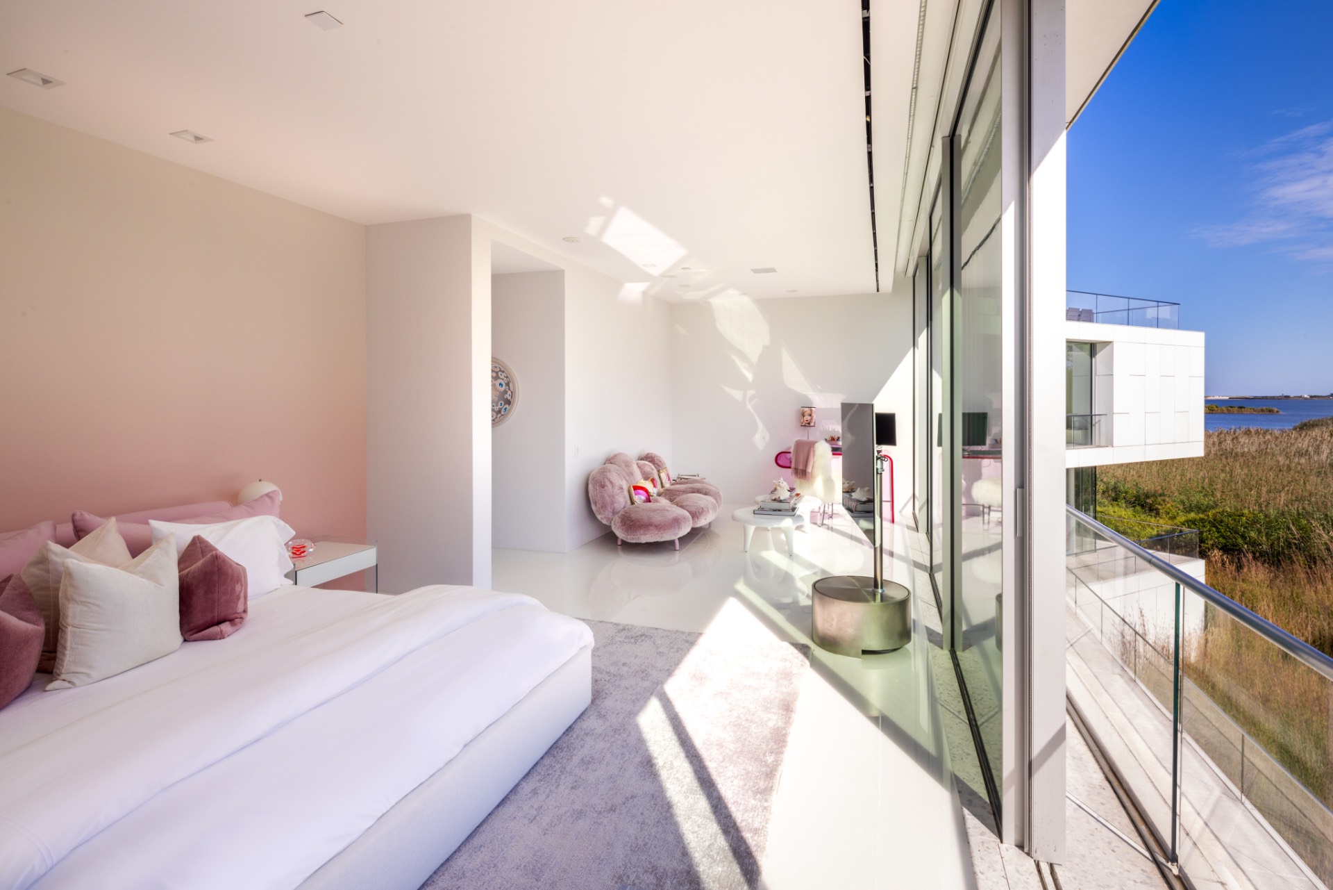 34 Cobb Isle Road Water Mill, NY 11976 - Photo 36 of 37 a bedroom with a bed and potted plant