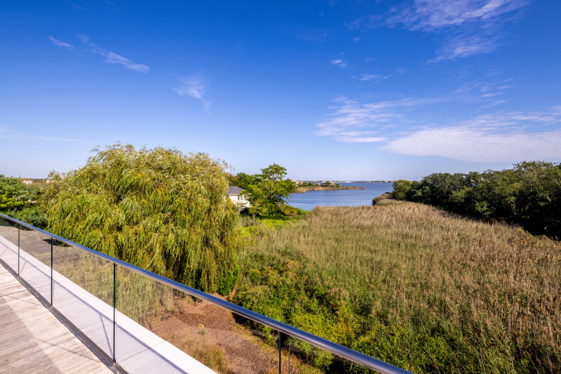 34 Cobb Isle Road Water Mill, NY 11976 - Photo 37 of 37 a view of a lake from a balcony