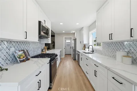 a spacious bathroom with double sink and a mirror