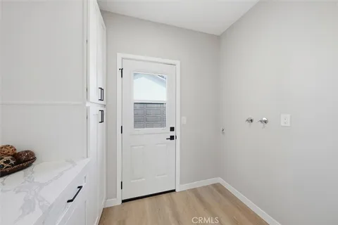 a living room with a bed furniture and a window