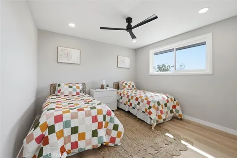 a bedroom with bed and window
