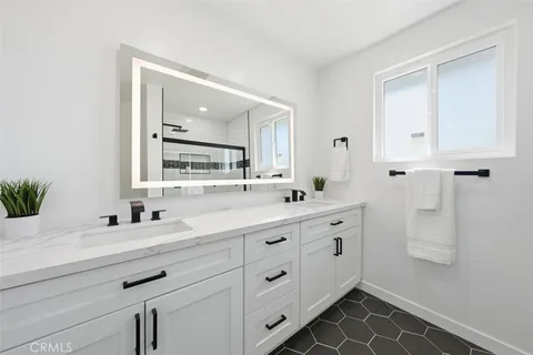 a bathroom with a shower and a glass door