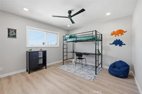 a spacious bedroom with a bed and a fireplace