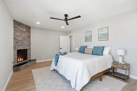 a bedroom with a bed and a fireplace