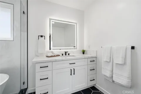 a bathroom with a bathtub and shower