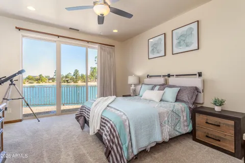 a bed room with a bed and a chandelier