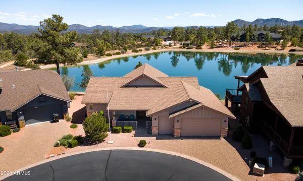 an aerial view of a house with a lake view