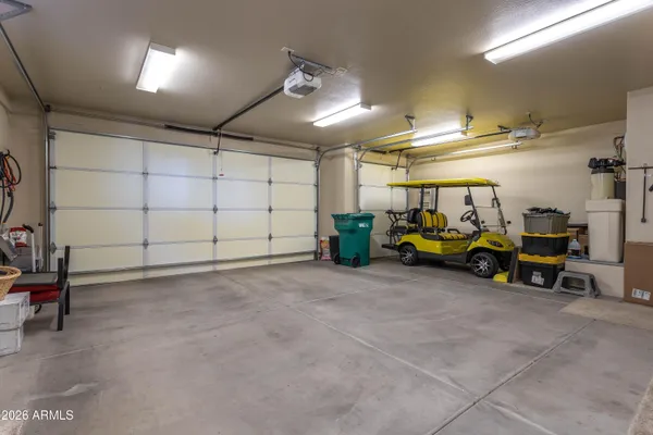 a view of a garage with parked cars