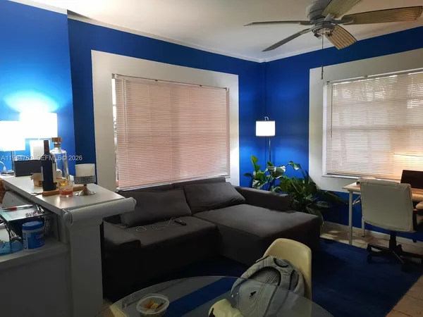 a living room with furniture and a window