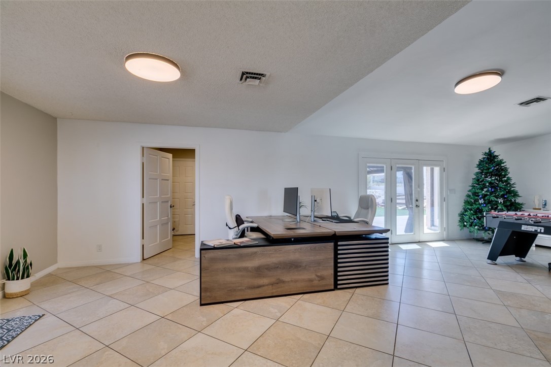 892 North Hollywood Boulevard Las Vegas, NV 89110 - Photo 27 of 81 This spacious interior features ample natural light and direct outdoor access.