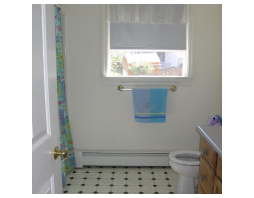 1 Robbins Road Ayer, MA 01432 - Photo 11 of 15 a bathroom with a toilet a sink and a window