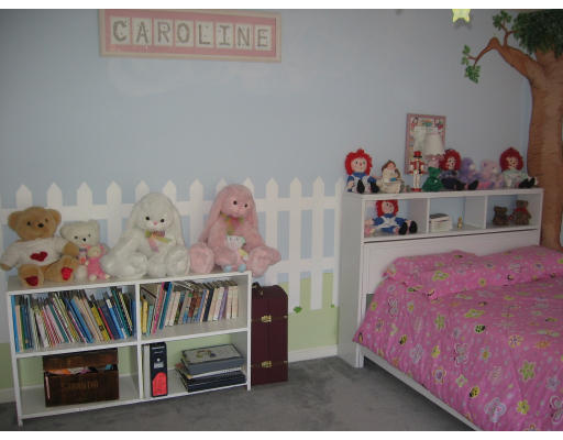 1 Robbins Road Ayer, MA 01432 - Photo 6 of 15 a bedroom with furniture and book shelf