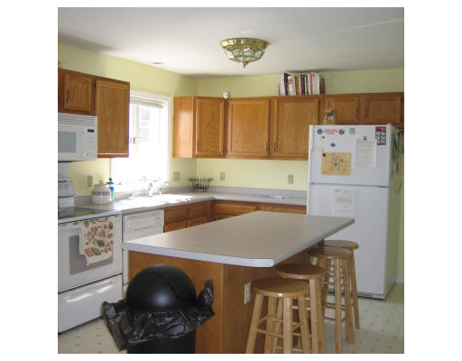 1 Robbins Road Ayer, MA 01432 - Photo 9 of 15 a kitchen with a sink a stove and cabinets