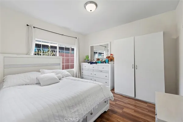 a bedroom with a bed and a cabinets