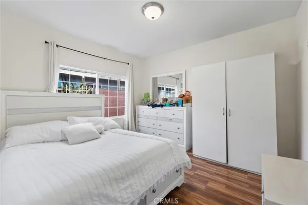a bedroom with a bed and a cabinets