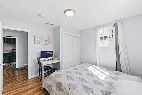 a bedroom with a bed and a table in it