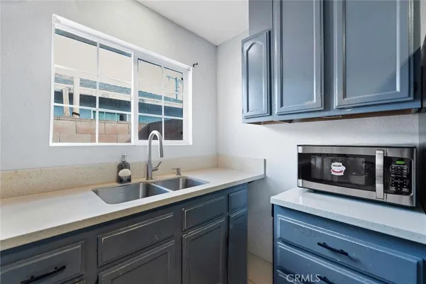 a kitchen with a sink and cabinets