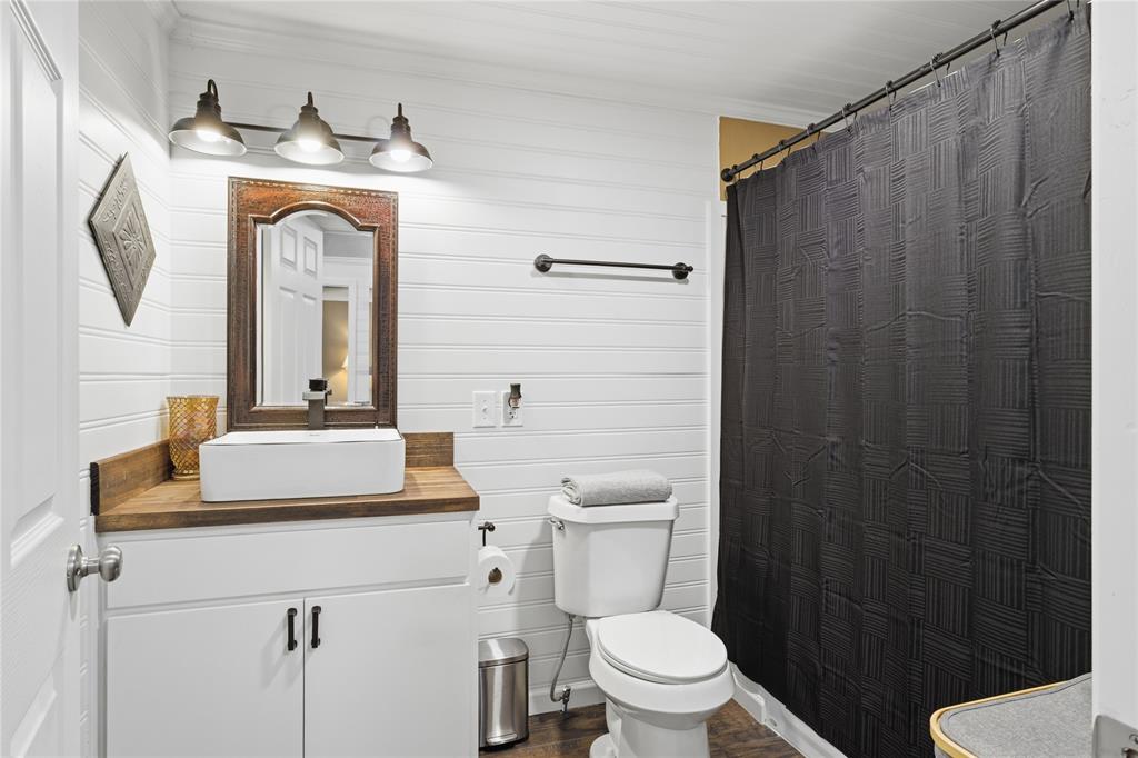 10 Ss Cooper, TX 75432 - Photo 21 of 40 a bathroom with a sink a toilet and shower