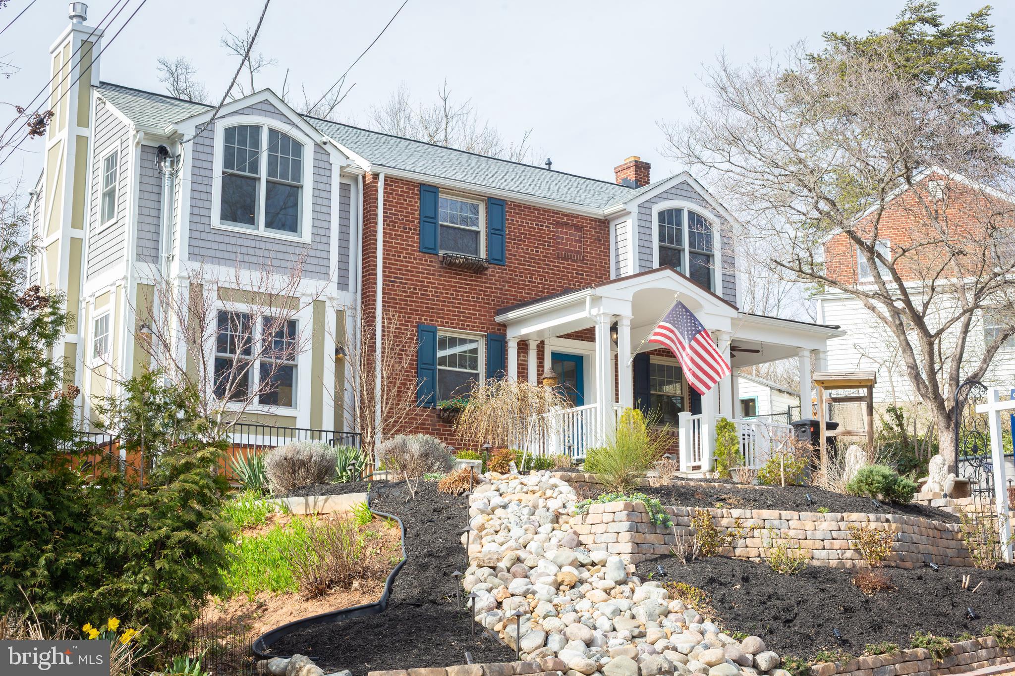 1213 Forest Glen Road Silver Spring, MD 20901 - Photo 1 of 57 a front view of a house with a yard