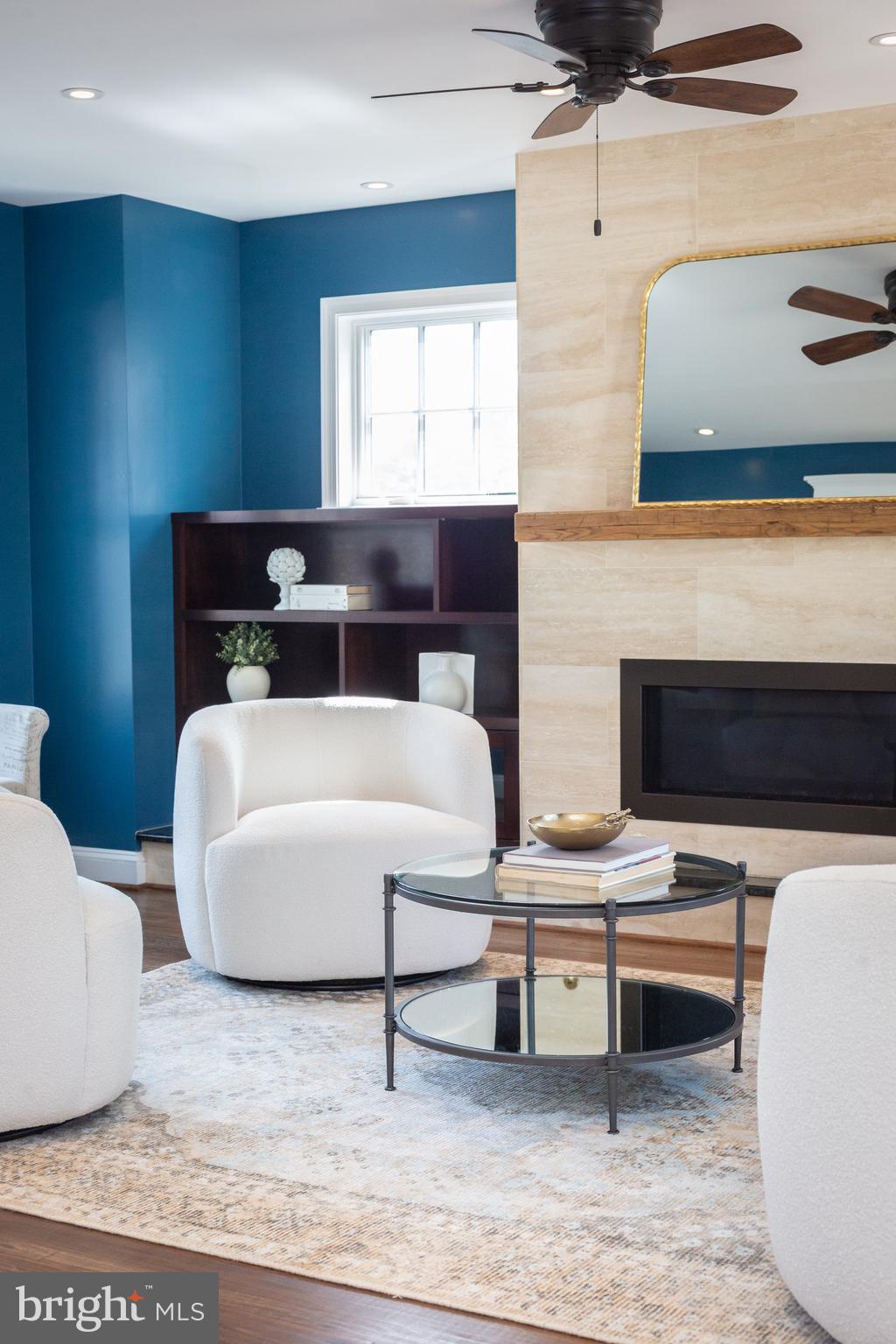 1213 Forest Glen Road Silver Spring, MD 20901 - Photo 13 of 57 a living room with furniture and a fireplace