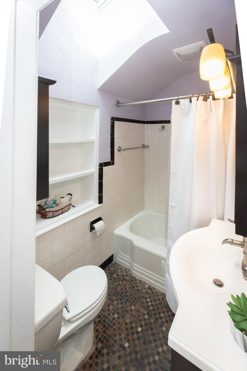 1213 Forest Glen Road Silver Spring, MD 20901 - Photo 31 of 57 a bathroom with a toilet and a shower