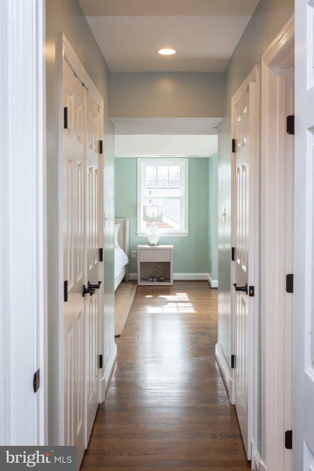 1213 Forest Glen Road Silver Spring, MD 20901 - Photo 37 of 57 a view of a hallway with wooden floor and windows