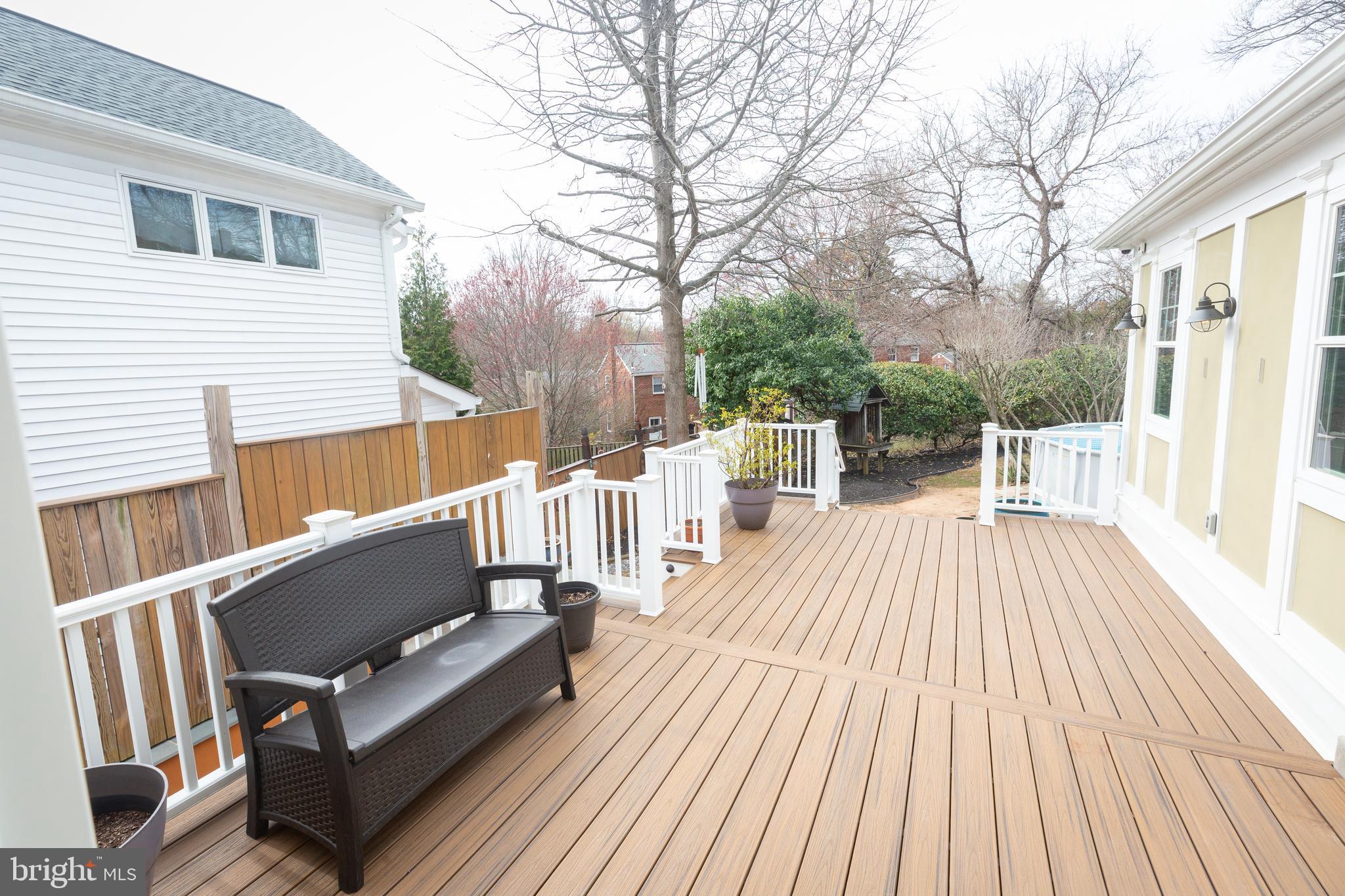 1213 Forest Glen Road Silver Spring, MD 20901 - Photo 45 of 57 a view of sitting area on roof with wooden floor and fence