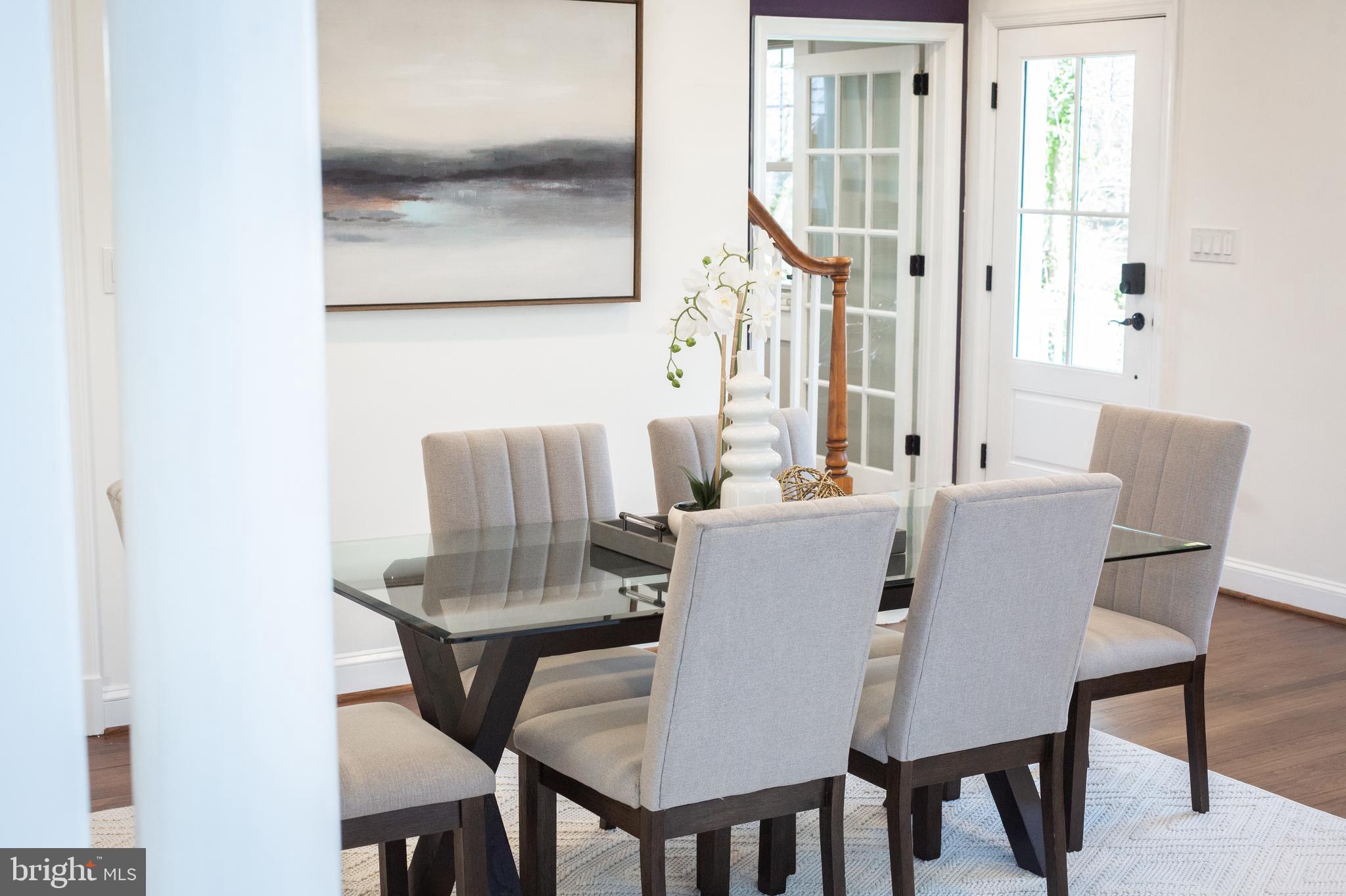 1213 Forest Glen Road Silver Spring, MD 20901 - Photo 6 of 57 a view of a dining room with furniture and wooden floor