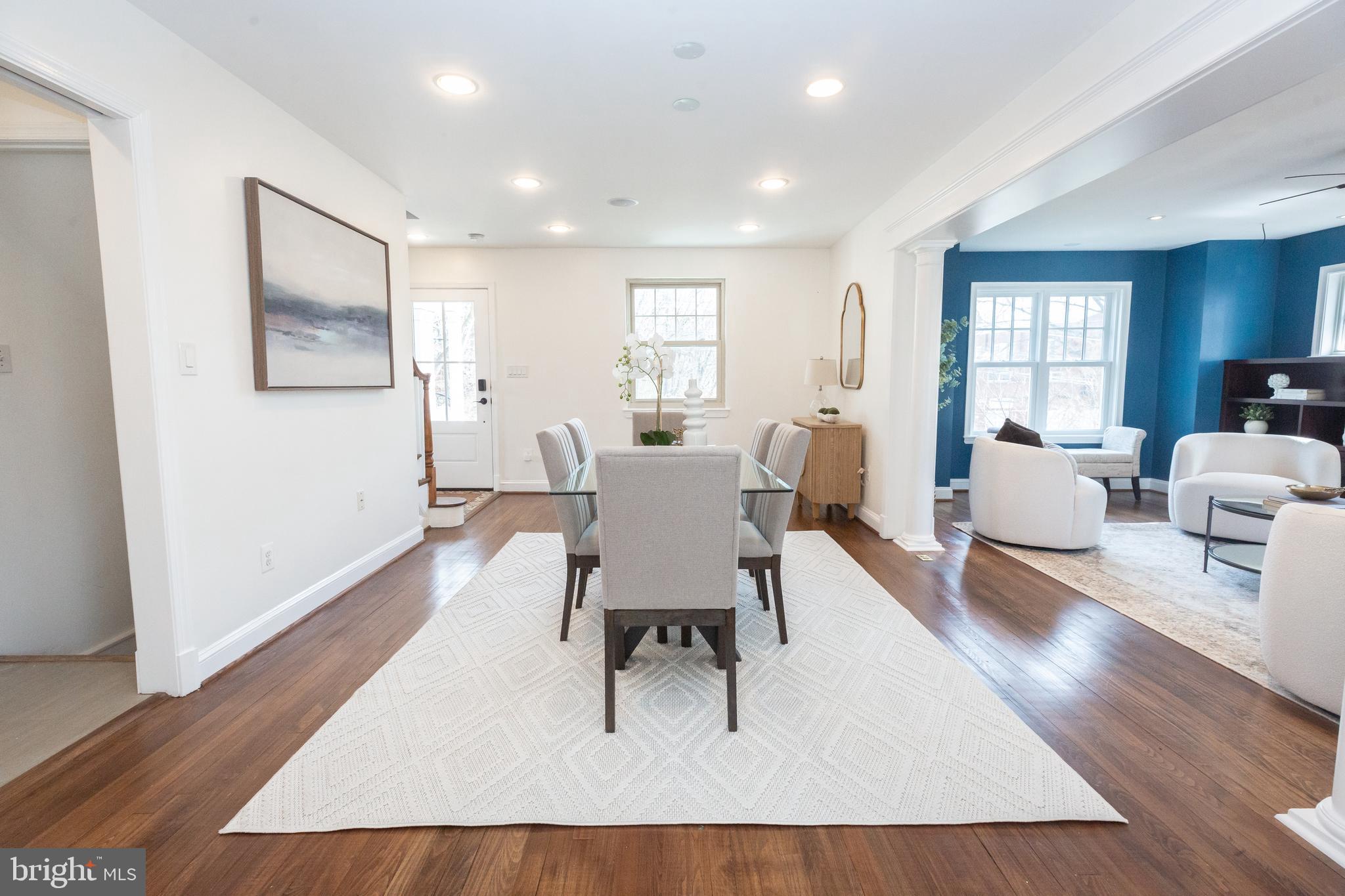 1213 Forest Glen Road Silver Spring, MD 20901 - Photo 8 of 57 a living room with furniture a wooden floor and a window