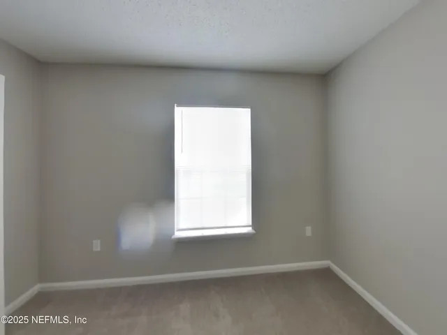 a bathroom with a bathtub and toilet