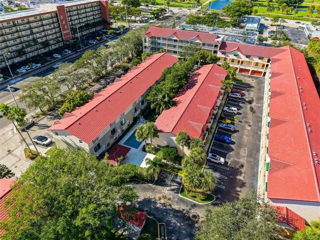 a kitchen with a white cabinets and wooden floor