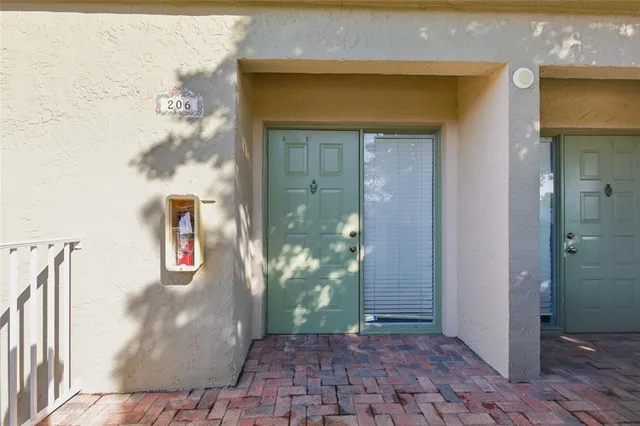 a kitchen with cabinets stainless steel appliances and wooden floor