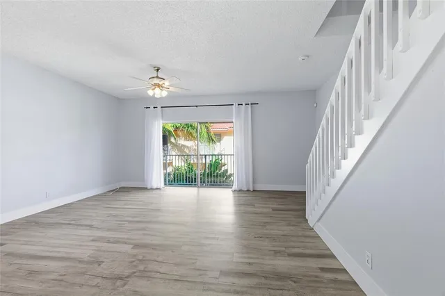 a view of an entryway with wooden floor