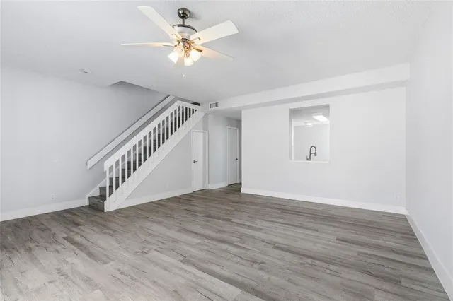a view of a kitchen with a white cabinet and a stove top oven