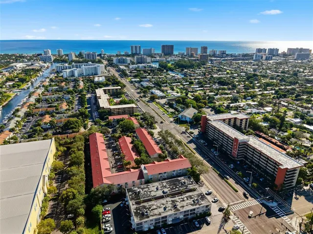 a backyard of a house with barbeque oven table and chairs
