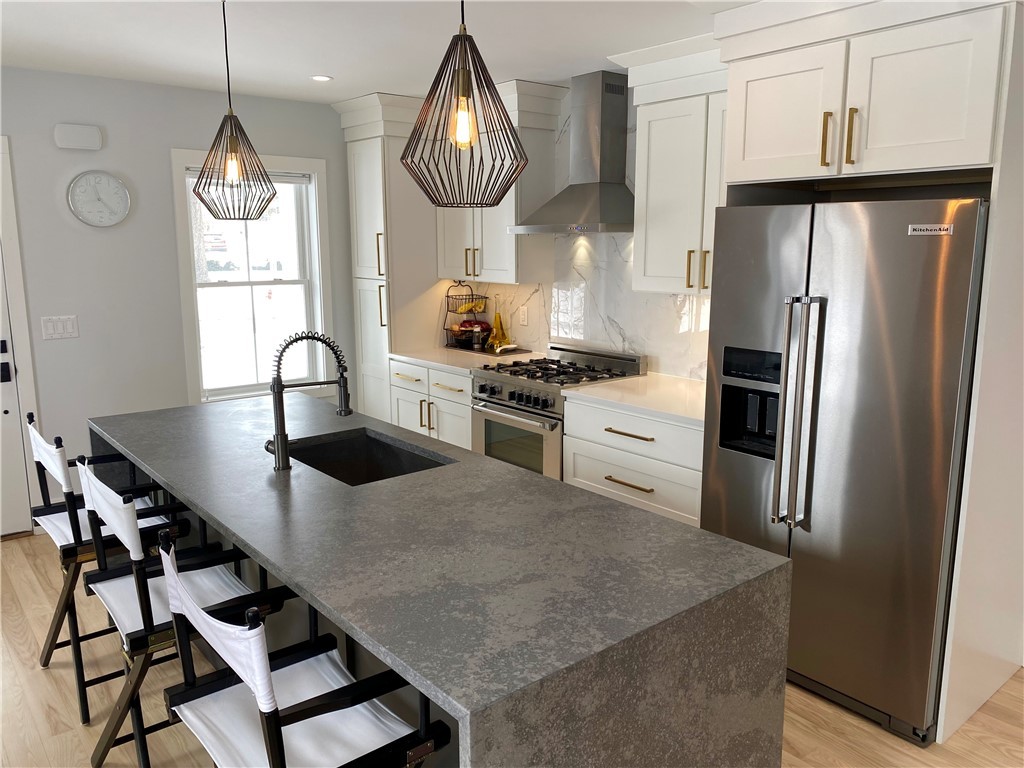 145 Graystone Street Warwick, RI 02886 - Photo 7 of 23 Previously constructed home with similar kitchen layout. Finishes and appliances may differ