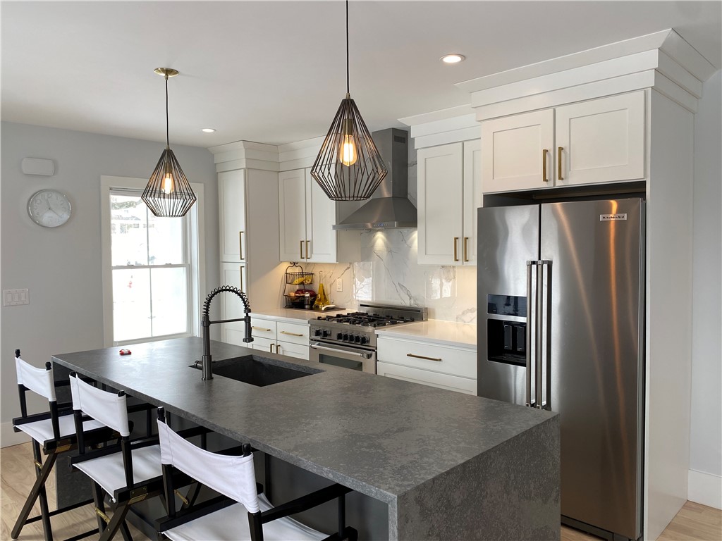 145 Graystone Street Warwick, RI 02886 - Photo 9 of 23 Previously constructed home with similar kitchen layout. Finishes and appliances may differ