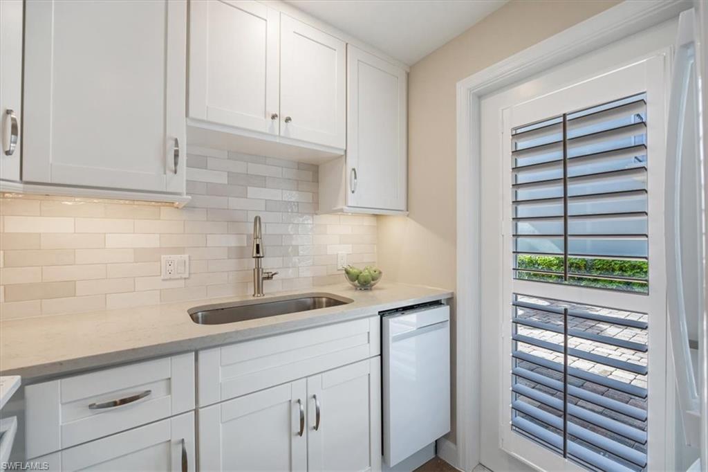 626 12th Avenue South, Unit 626 Naples, FL 34102 - Photo 20 of 50 a kitchen with a sink and cabinets