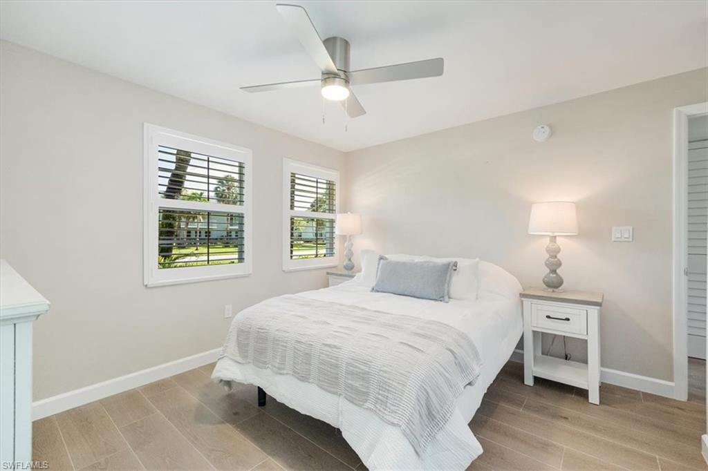 626 12th Avenue South, Unit 626 Naples, FL 34102 - Photo 28 of 50 a bedroom with a bed and a window